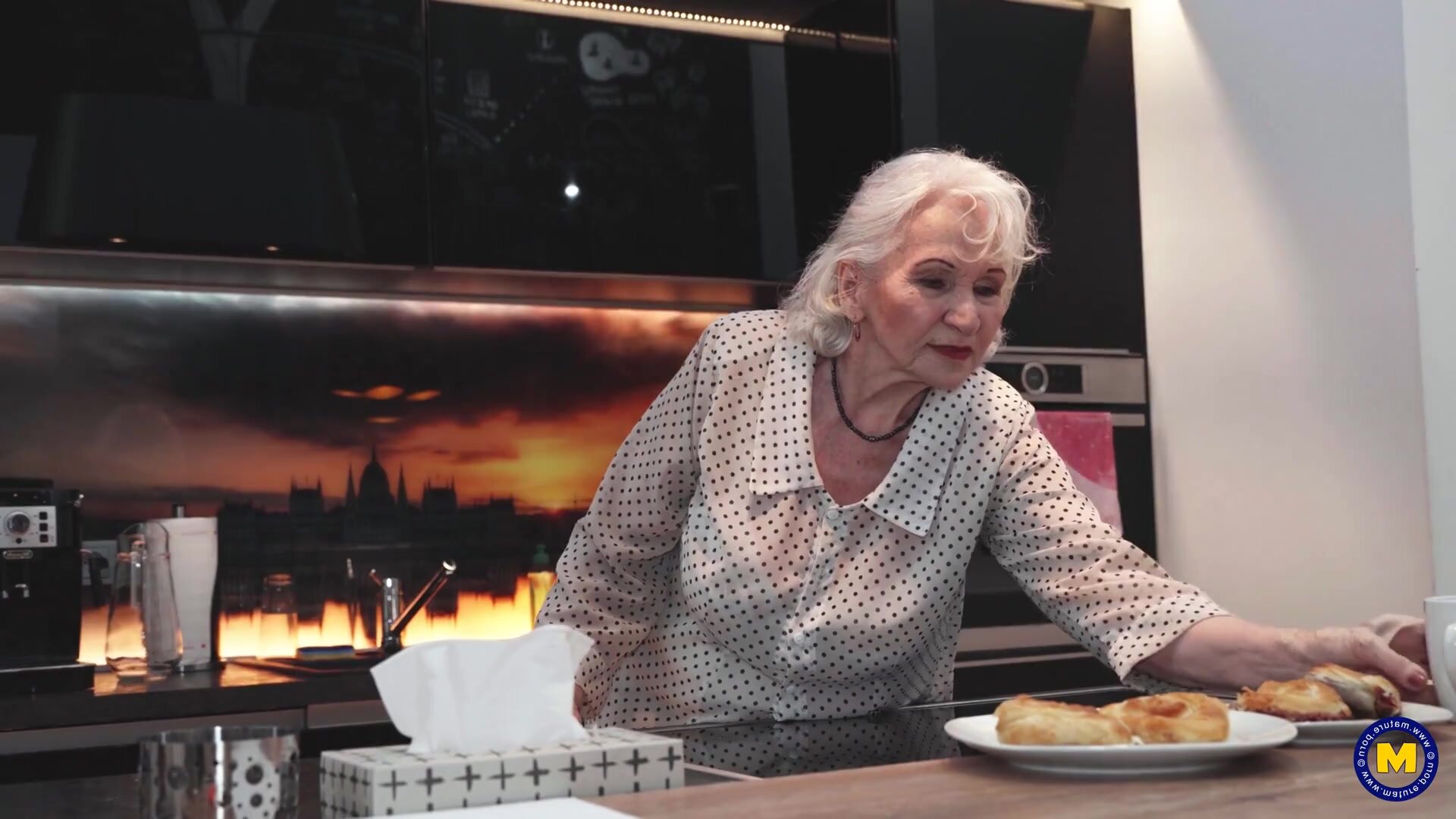 The elderly woman residing adjacent extended an invitation to her brawny male neighbor to visit her residence.